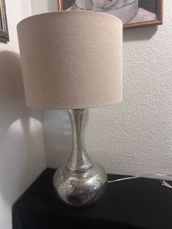 Table lamp with silver mercury glass body and linen lampshade