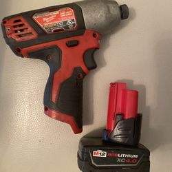 Milwaukee 1/4 Inch impact driver and battery