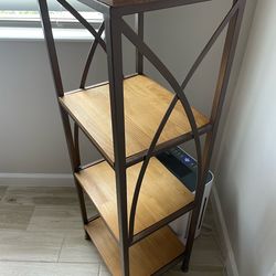 Modern industrial-style 4-tier shelving unit with a sturdy metal frame and warm wood shelves