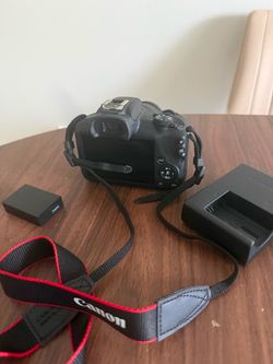 Eos r100 with strap, battery charger and battery