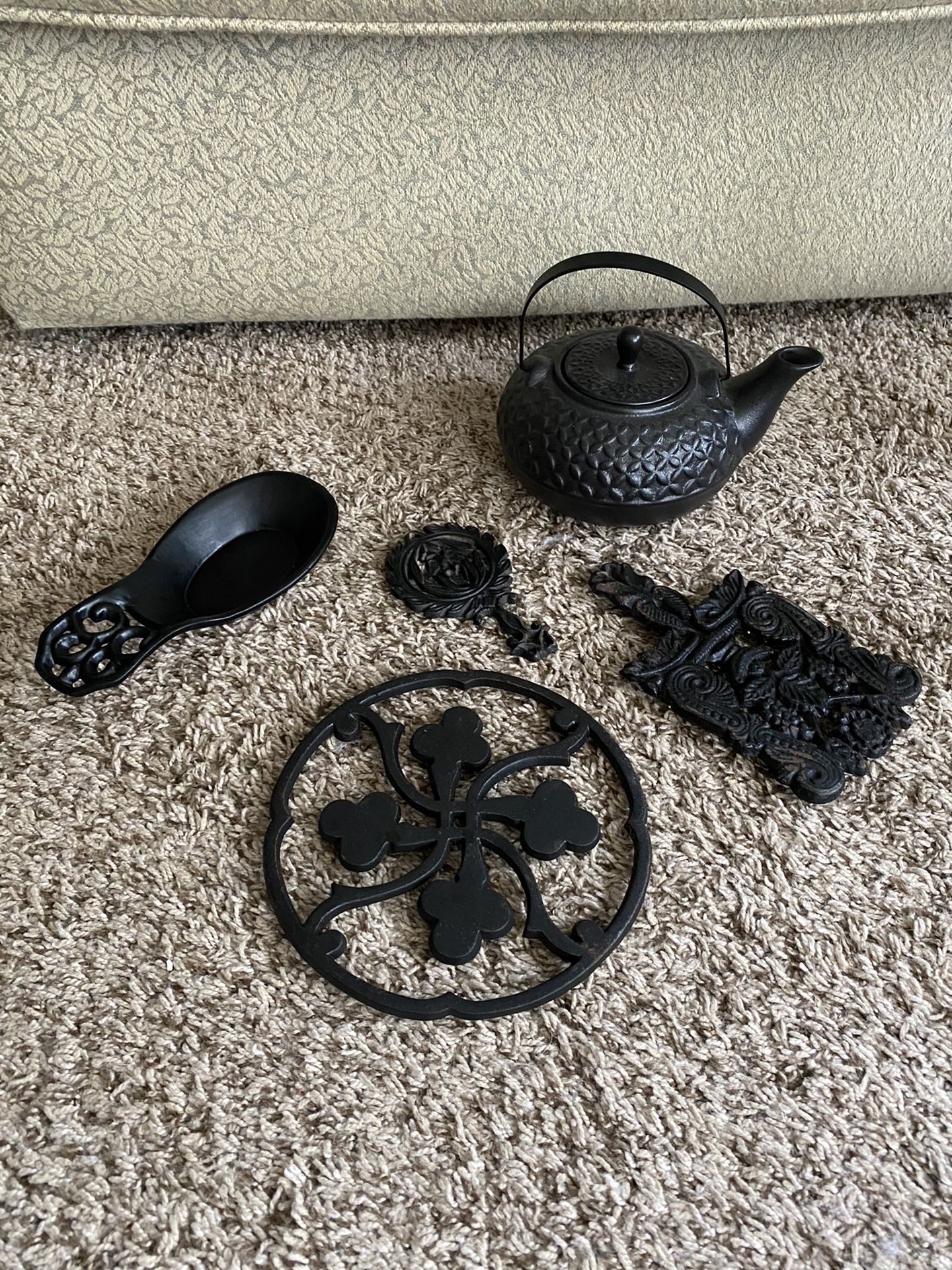 Ceramic tea pot and cast iron trivets