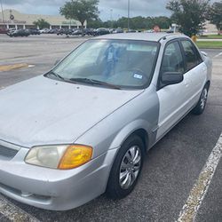 2000 Mazda Protege for sale with clear title. AC/Heat work. Asking price: $1,800. Runs great.