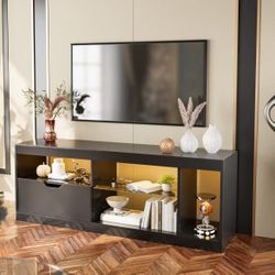 Modern LED TV stand for TVs up to 65 inches with shelves and glass drawers $100