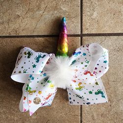New. New without tags. JoJo Siwa White Bow with Rainbow Unicorns Pom Pom
