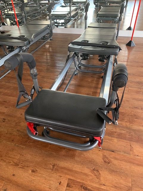 Megaformer Pilates workout machine.