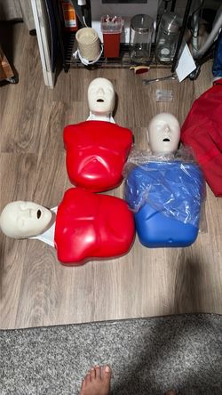 9 cpr manikins and a new AED trainer with bag