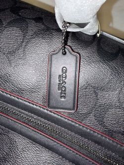Never used, still in packaging, large Coach Trekker duffel bag