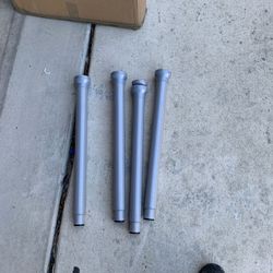 Glass desk/ table with adjustable height legs, capable of handling TVs or Computers.