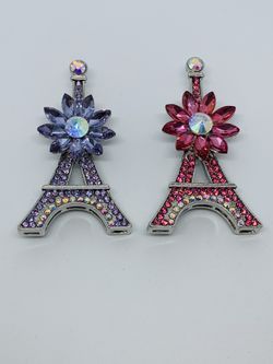 A set of 2 crystal Eiffel Tower brooch