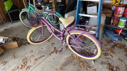 purple bike with basket