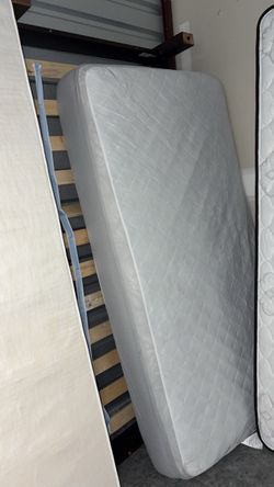 Twin mattress with wooden frame
