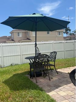 Patio table two chairs and umbrella