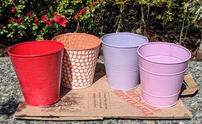 Tin pots, purple, pink, red, orange/white dots. Free plastic flower containers, round and square.