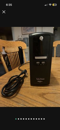 Cyber Power Battery Back Up 1500VA AVR is UPS means Uninterrupted Power Supply. Model is LX1500GU. 10 power out plugs. Great