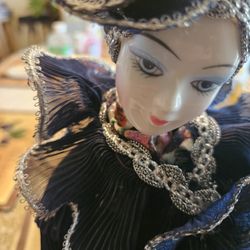 Vintage collectible porcelain and wind-up dancing doll