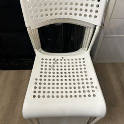 Four White Patio Chairs