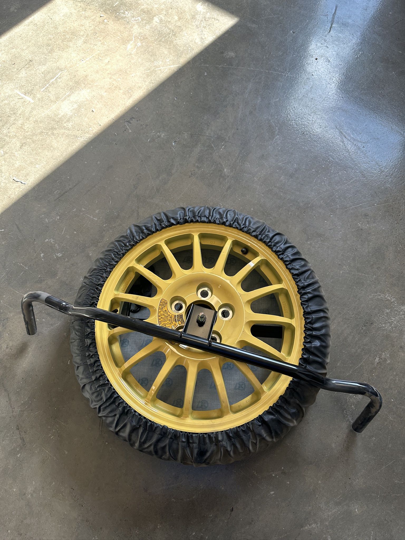 Brand new Rx8 Spare tire with mounting bar