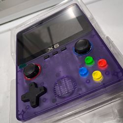 X6 Handheld retro video game console in transparent purple.  New.   fully laminated IPS OCA screen.  Features a dual 3D rocker design 4- core 32 bit p