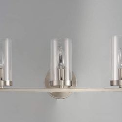 Maxim Sentinel 3-Light Bath Vanity in a satin nickel finish with clear glass shades.  