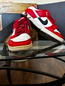 Nike Dunk Low sneakers in red, white, and black, size 8.5