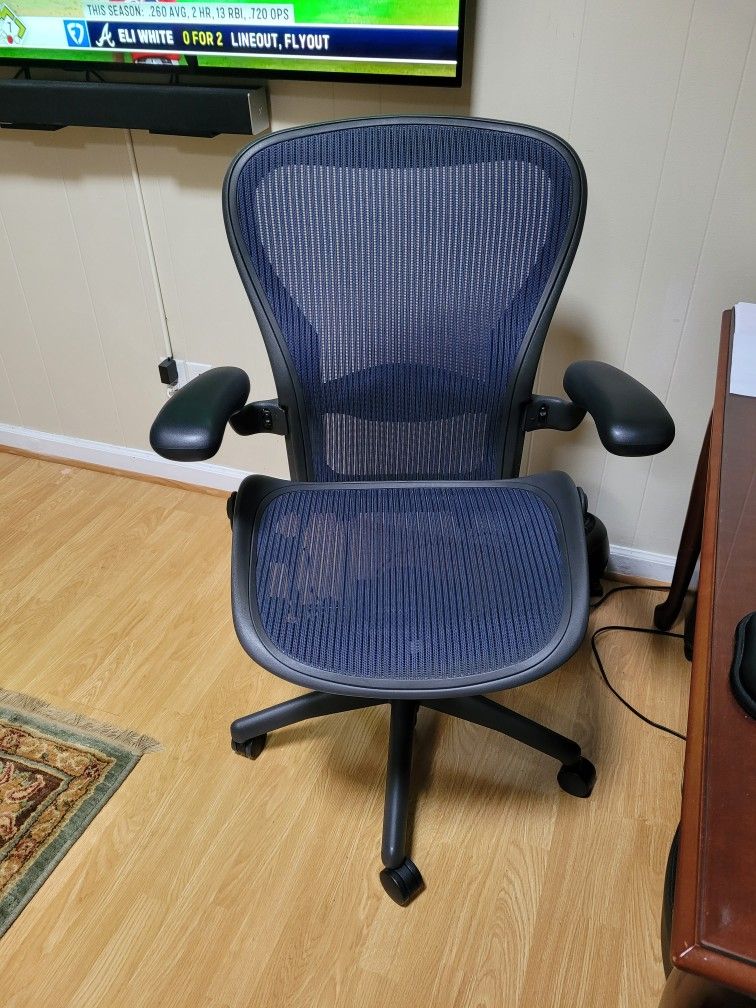 Herman Miller Aeron Size C Chair Fully Loaded With Adjustable Arm With Dark Blue Mesh.