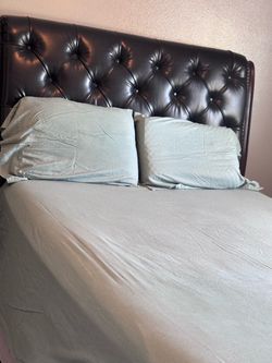 queen size bed with mattress and nightstand