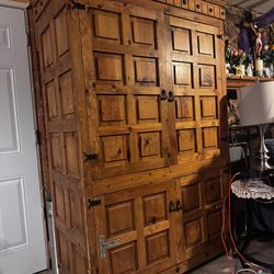 Mexican Spanish colonial style iron mounted paneled pine armoire