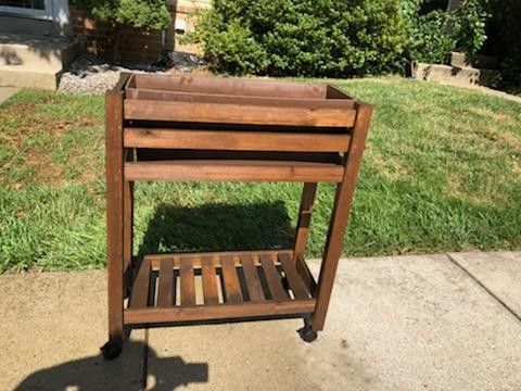 Plant stand on wheels that lock