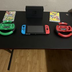 Nintendo switch/ Sonic Mania/ Super mario bros deluxe/both wheels/console/ controller