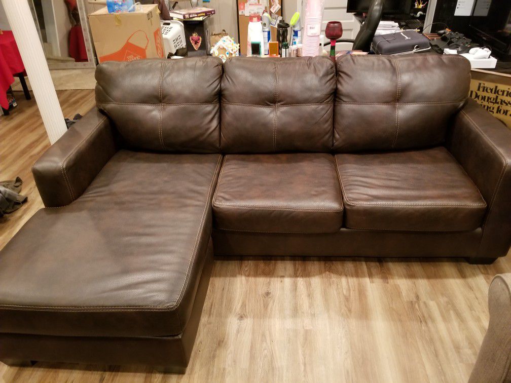 Leather brown couch with reversible sectional
