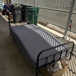 Twin Bed With Thick Mattress And Metal Headboard, And Footboard