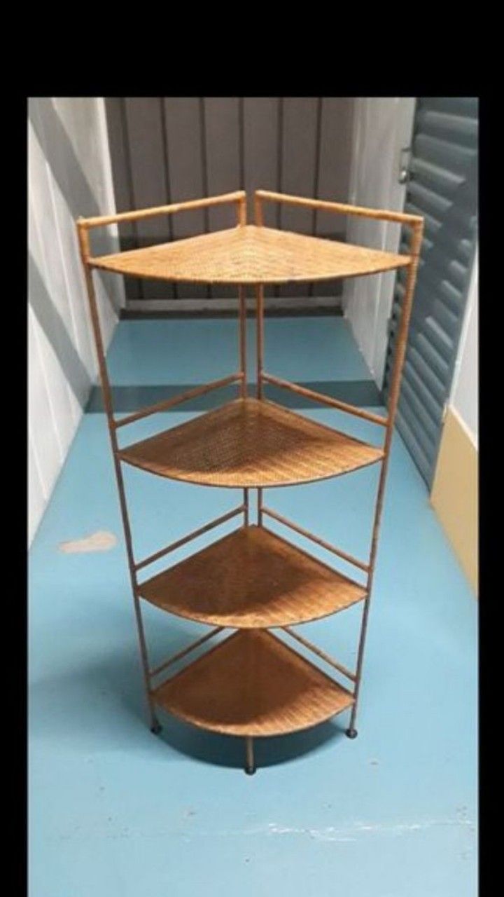 Beautiful wicker wrapped around a metal frame. Four tier shelving corner unit