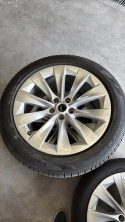 Two 275/45 R20 Tesla tires and wheels