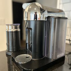 Nespresso Vertuo chrome  coffee maker, and espresso machine.