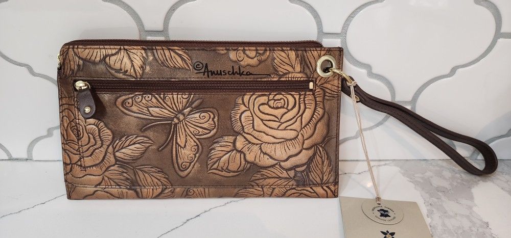 Hand painted embossed leather wristlet from J. Peterman