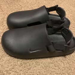 Black Nike slides