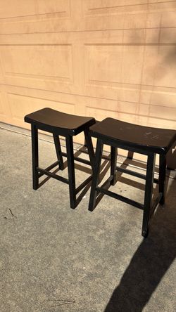 A pair of stools seat, seats, chair, chairs