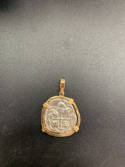 Atocha silver coin pendant in gold bezel