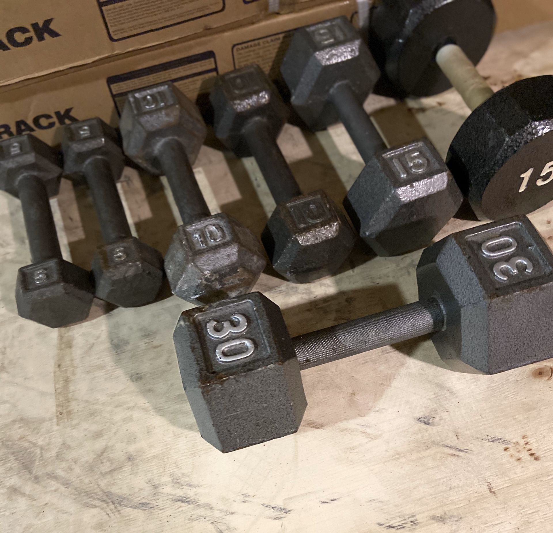 Metal hex dumbbells pair of 5s 10s 15s and a single 30lbs.