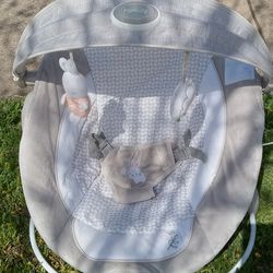 Ingenuity InLighten Baby Bouncer Seat with Light Up Toy Bar