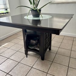 52" Dark Wood Table with Lazy Susan and Storage