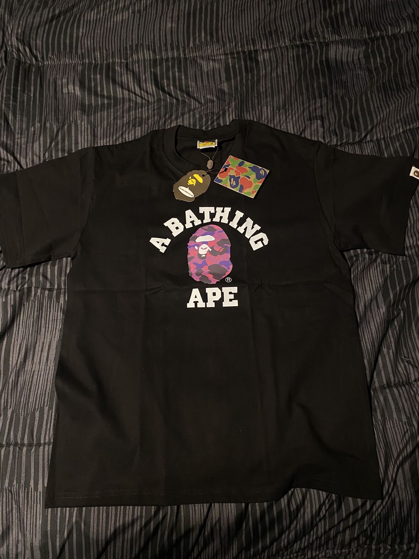 A Bathing Ape Bape purple shirt.