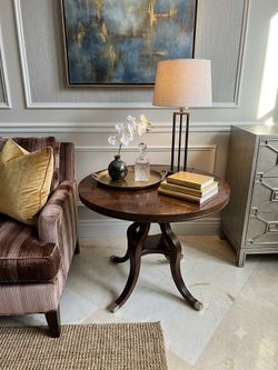 Century Furniture Casual Dining Tribeca Round Dining Table, crafted from dark wood with an elegant pedestal base and silver-capped feet