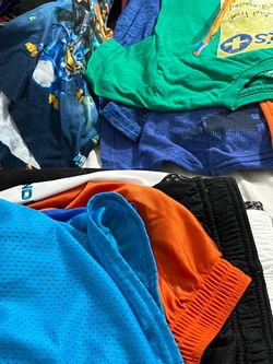 Bags of woman kids and men clothing hundreds of clothing and shoes