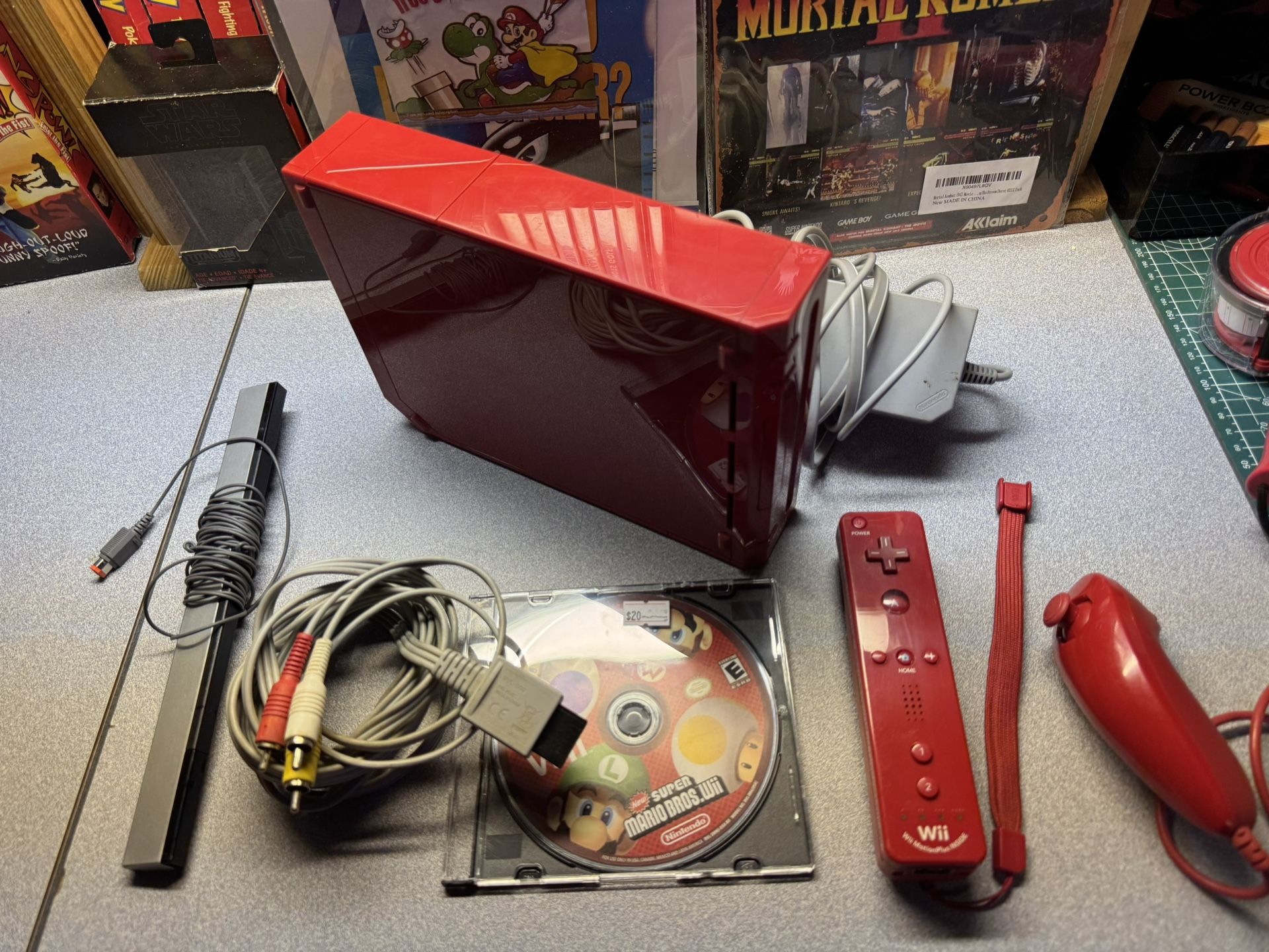 Red Nintendo Wii with new mario bros Wii