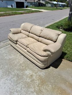 Beige couch, Free end of driveway 6643 Easton Dr Sarasota