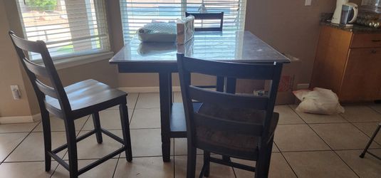 Beautiful bar height, table, and chairs