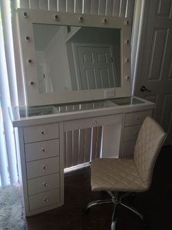 Vanity with mirror and chair