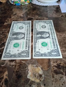 Dos billetes de un dólar 2017 con estrella ⭐