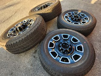 Ford f250-350 factory gloss black 20" wheels and tires